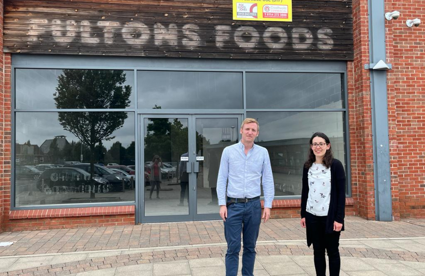 Lee with Cllr Charlotte Cupit outside Fultons Foods